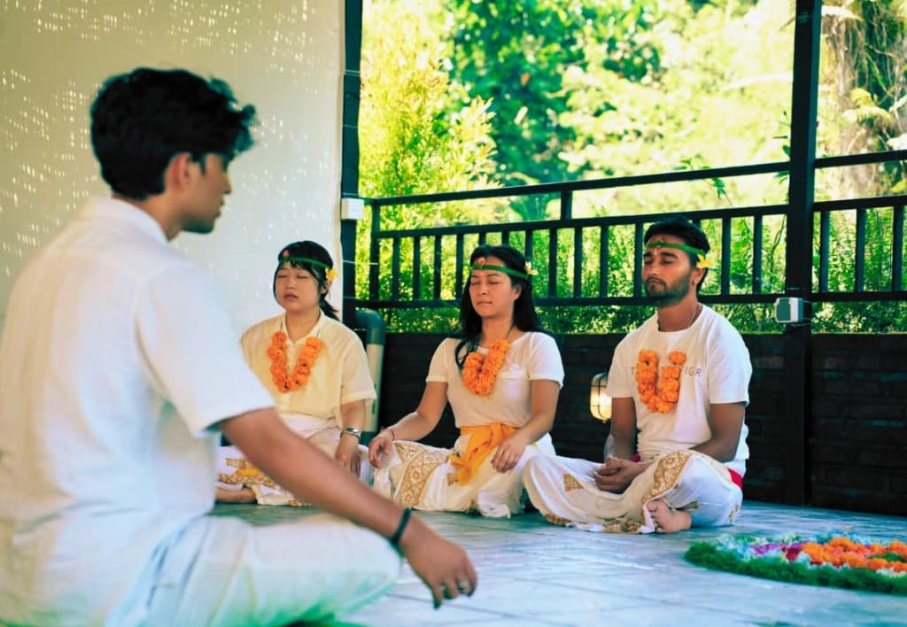 Traditional Balinese opening ceremony and meditation with flower garlands at Bali YTTC