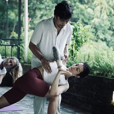 Nyoman performing Crow Pose